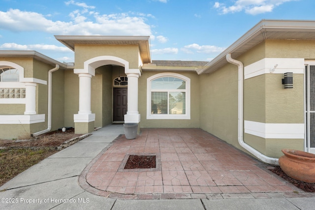 doorway to property featuring a patio