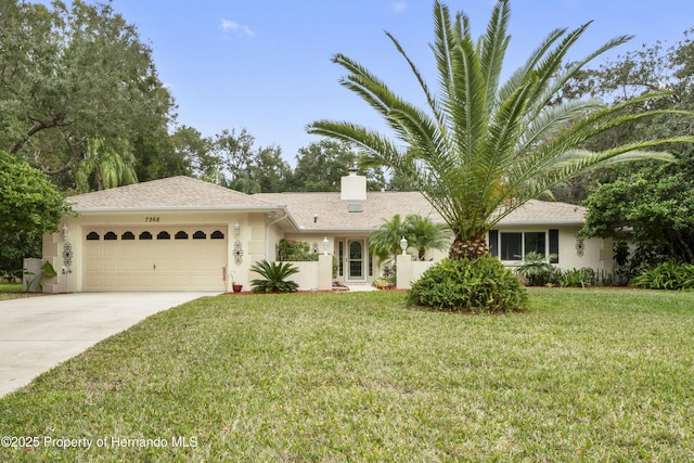 ranch-style home featuring a front lawn and a garage