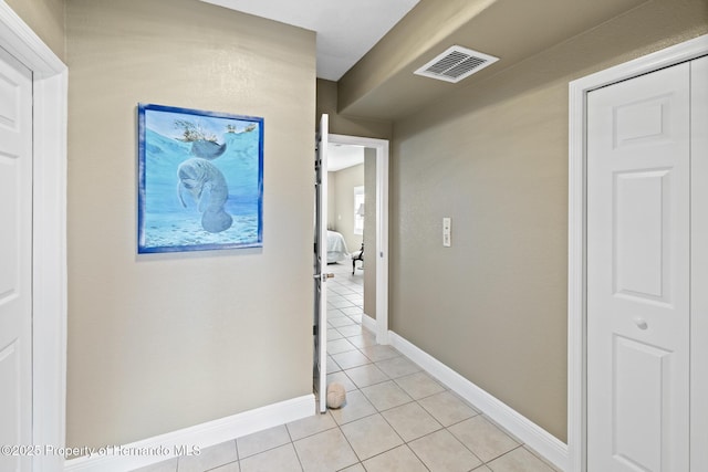 hallway featuring light tile patterned floors