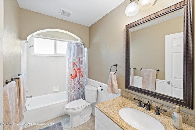 full bathroom featuring toilet, vanity, and shower / bath combo