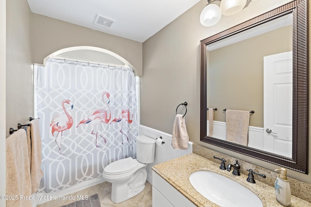 bathroom with toilet and vanity