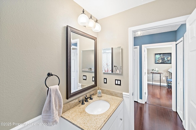 bathroom with vanity and wood-type flooring