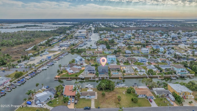 aerial view at dusk with a water view