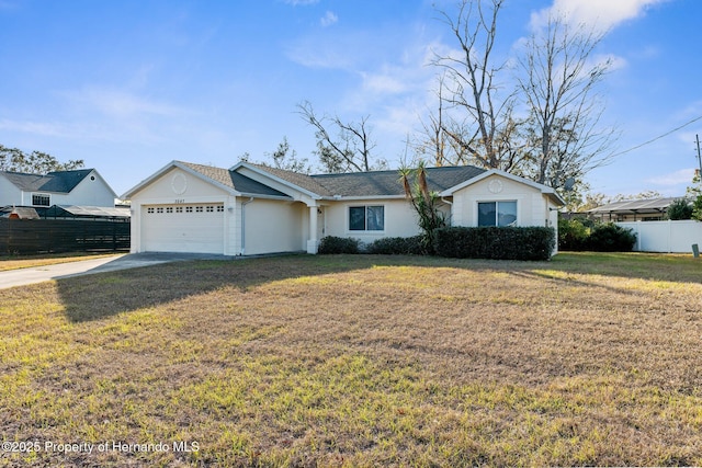 ranch-style home with a front lawn and a garage