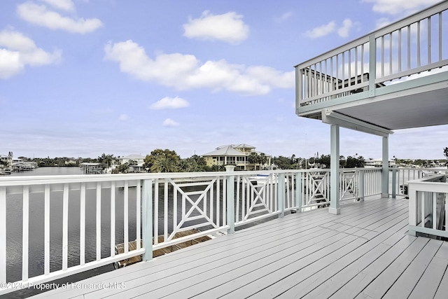 wooden terrace with a water view