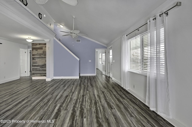 unfurnished living room featuring vaulted ceiling, dark wood-type flooring, ceiling fan, and ornamental molding