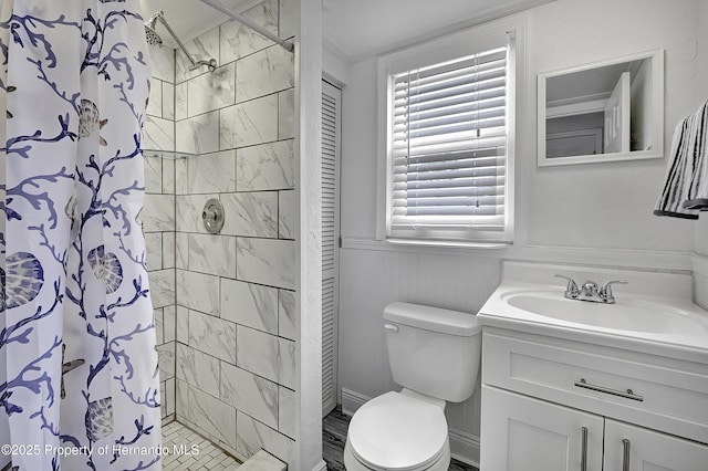 bathroom with vanity, walk in shower, and toilet