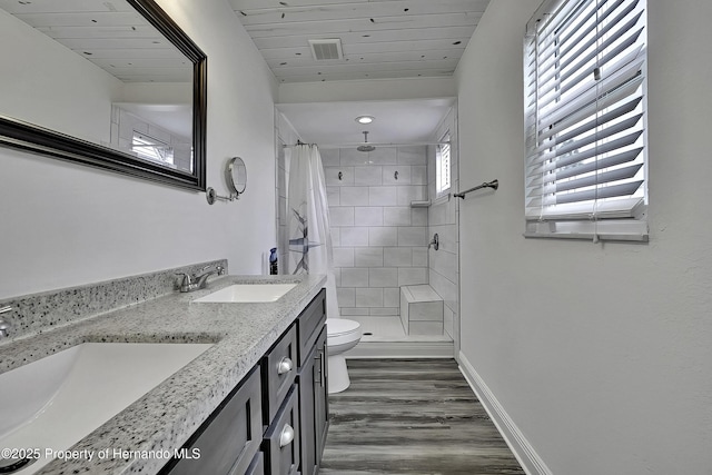 bathroom featuring toilet, a shower with curtain, wood ceiling, and hardwood / wood-style floors