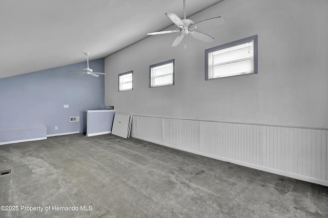 carpeted empty room with lofted ceiling and ceiling fan