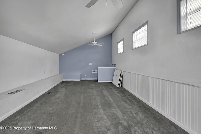 interior space featuring ceiling fan and vaulted ceiling