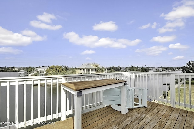 wooden terrace with a water view