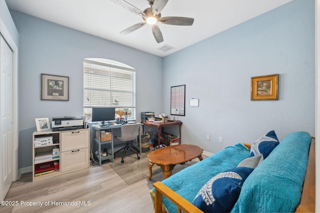 office featuring light wood-type flooring and ceiling fan