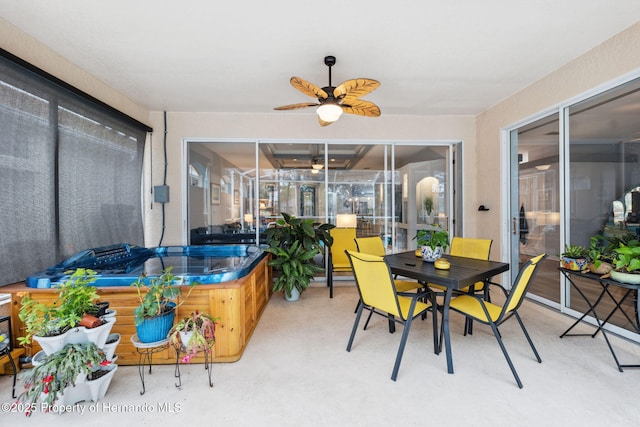 sunroom / solarium with ceiling fan