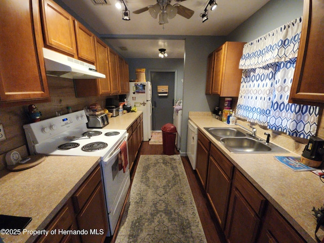 kitchen featuring ceiling fan, white appliances, and sink