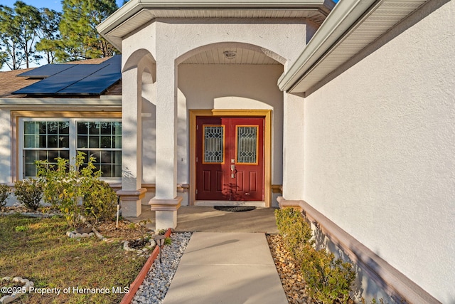 entrance to property with solar panels