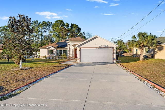 single story home featuring solar panels and a front yard