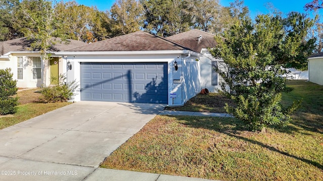 exterior space featuring a garage and a front lawn