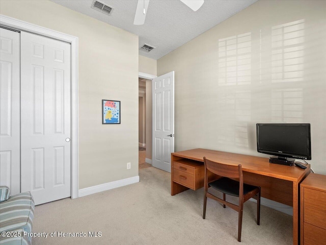 carpeted office featuring ceiling fan