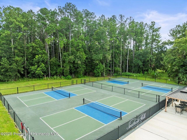 view of sport court with basketball hoop