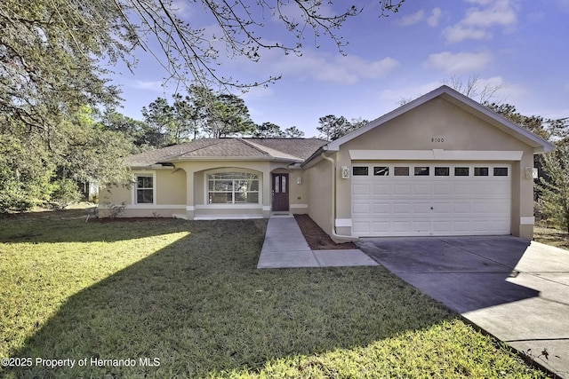 ranch-style house with a garage and a front lawn