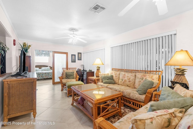 tiled living room featuring ceiling fan