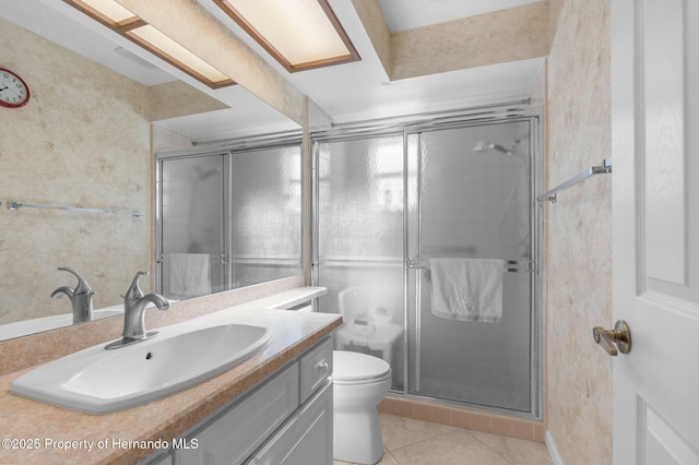 bathroom featuring vanity, an enclosed shower, tile patterned flooring, and toilet