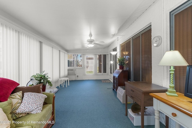 sunroom / solarium featuring ceiling fan