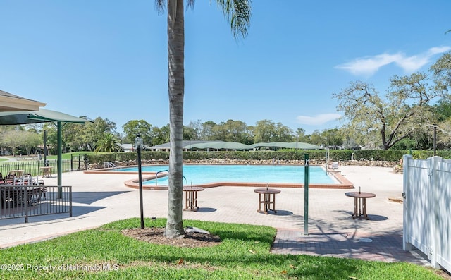 view of swimming pool featuring a patio