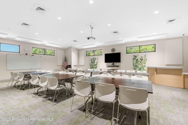 dining room featuring light colored carpet