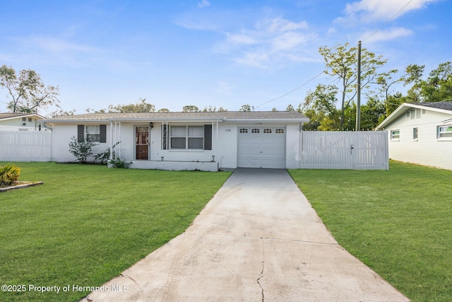 single story home featuring a front yard and a garage