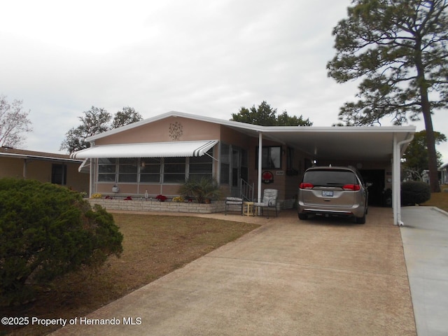 view of front of home featuring a carport