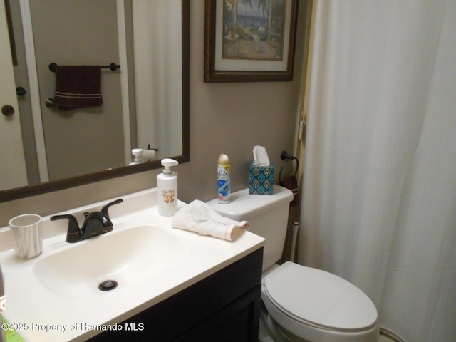 bathroom with vanity and toilet