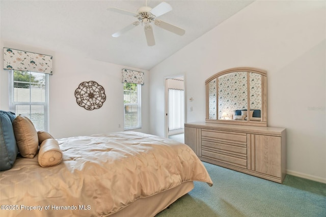 carpeted bedroom with ceiling fan and lofted ceiling