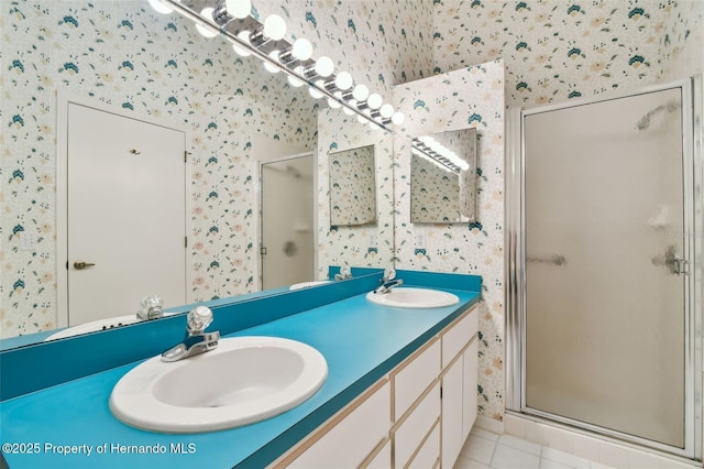 bathroom featuring vanity, an enclosed shower, and tile patterned floors