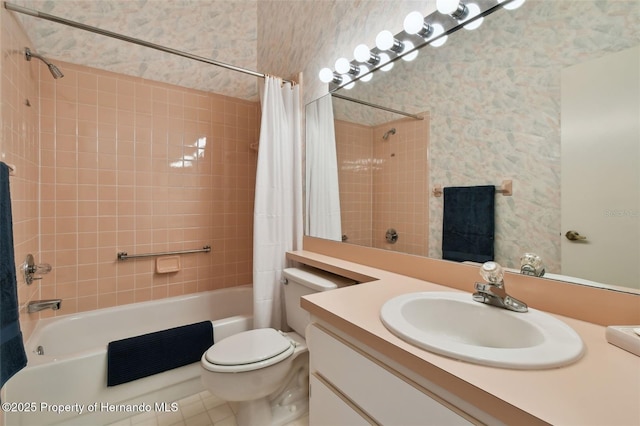 full bathroom featuring toilet, vanity, tile patterned floors, and shower / bath combination with curtain