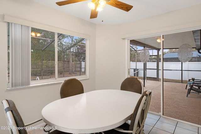 tiled dining room featuring a wealth of natural light