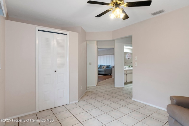 hall with light tile patterned flooring