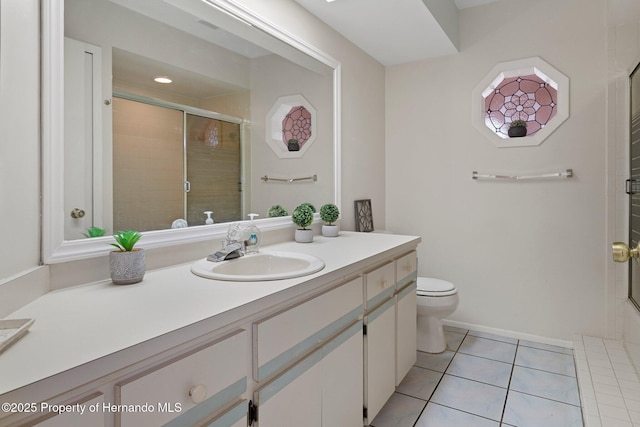 bathroom featuring walk in shower, toilet, tile patterned floors, and vanity