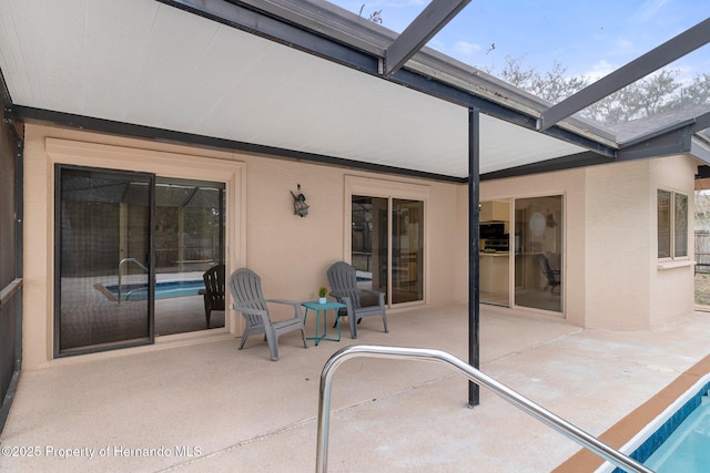 view of patio with a lanai