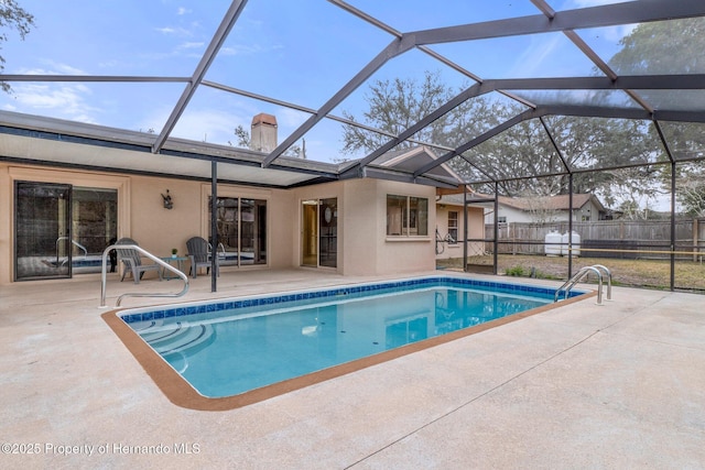 view of pool with a lanai and a patio area