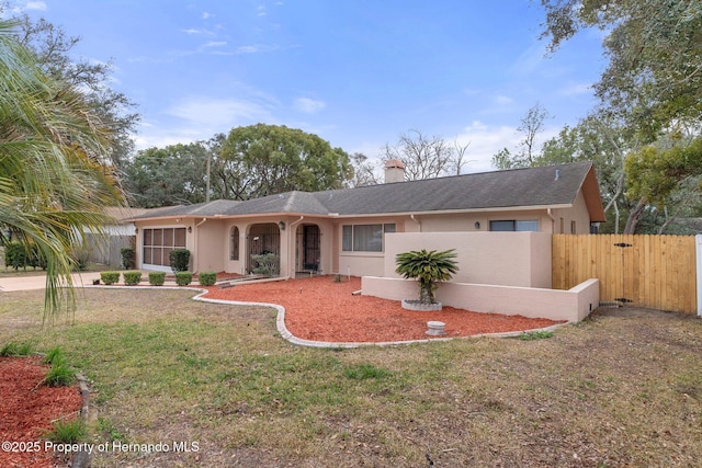 ranch-style house with a front yard