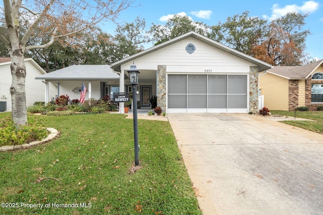 single story home featuring a porch, central AC unit, a front lawn, and a garage