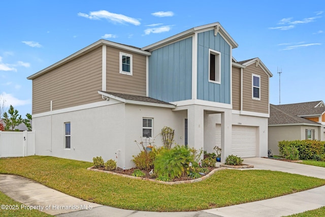 view of front facade with a front yard and a garage