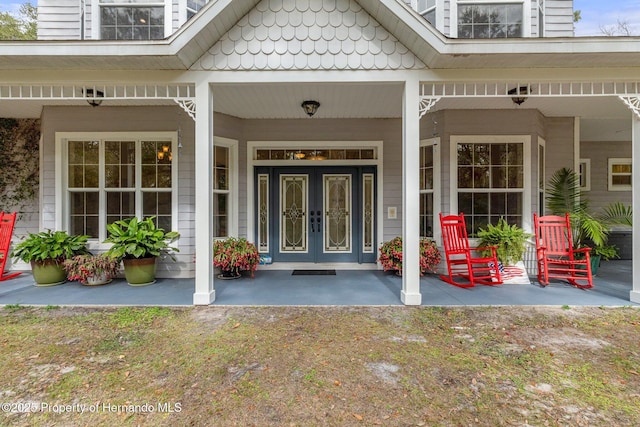 view of exterior entry featuring french doors