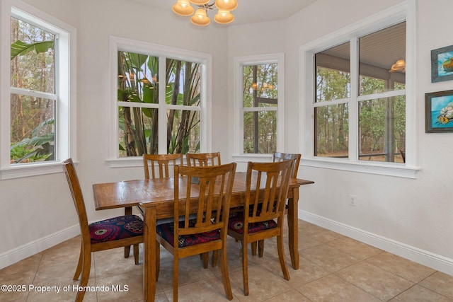 tiled dining area with a notable chandelier