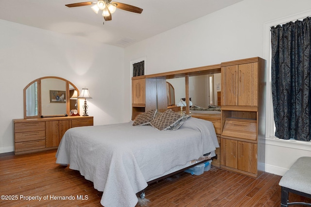 bedroom featuring ceiling fan and wood-type flooring