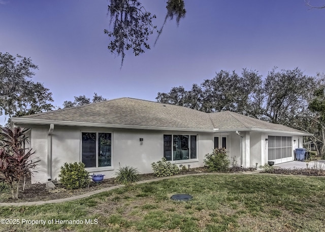 ranch-style house with a front yard