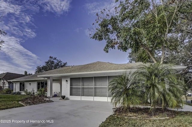 ranch-style house featuring a garage