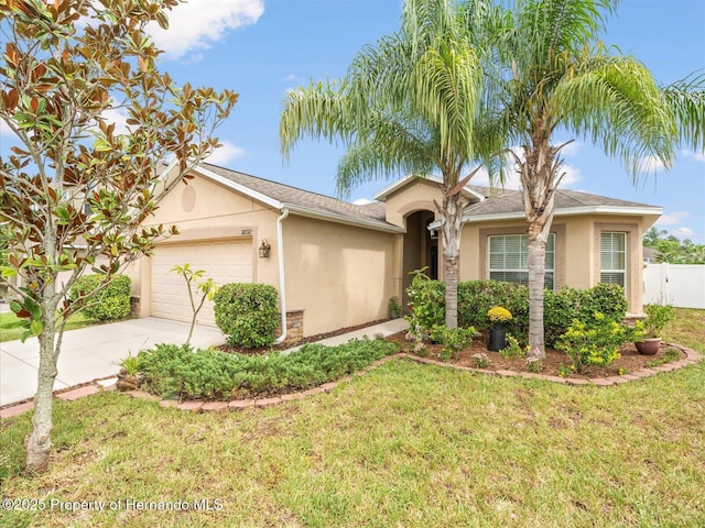 single story home featuring a front yard and a garage