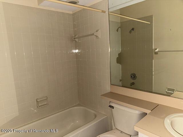 full bathroom with toilet, tub / shower combination, and vanity